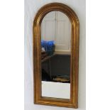 A contemporary arch top gilt framed wall mirror, 72cm high.