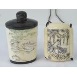A late 19th century bone scent pot decorated with erotic scenes upon,