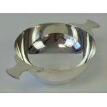 A HM Scottish silver quaich of plain form having twin handles and 10cm dia bowl,