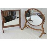 Two toilet mirrors; one oval measuring 50cm wide, the other square and measuring 43cm wide.