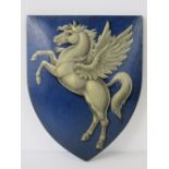 A hand painted oak shield featuring Pegasus winged horse upon and stamped 'W & A Masetti London'