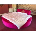A very large and impressive 'circular' bed comprising standard king-size bed with extra rounded