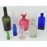 A small collection of glassware inclusing a Cranberry glass jug having fluted rim standing 15cm