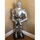 An impressive life-size freestanding reproduction full suit of armour,