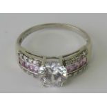 A 9ct white gold cocktail ring encrusted with white and pink cz stones, stamped 375, size R.