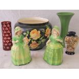 A pair of heavy ceramic crinoline lady figurines, each for use as a doorstop, 20cm high.