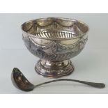 A large silver plated embossed punch bowl of classical form decorated with swags upon, 25.