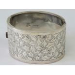 A HM silver cuff bangle having engraved ivy decoration to front, hallmarked Birmingham.