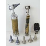 A vintage otoscope or auriscope complete with various nickle plated fittings.