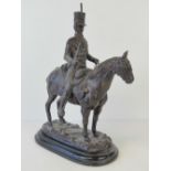 A bronzed patinated figure of a mounted Hussar after John R.