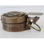 A reproduction military style brass compass marked T.G.Co Ltd London.