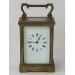 A brass five glass French carriage clock complete with key,