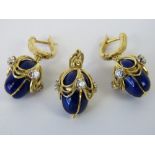 A delightful 14ct gold diamond and cobalt blue enamelled suite of jewellery comprising pendant and