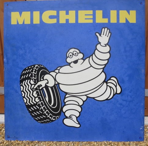 A vintage aluminium advertising sign for