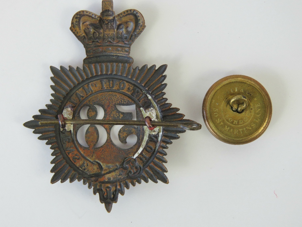 A Victorian shako plate helmet badge and matching tunic button for the 58th Regiment (Rutland). - Image 2 of 3