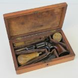 A fine cased Roots Colt percussion pistol with powder flask having embossed eagle with spread wings