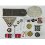 A quantity of assorted German badges, ribbon bars, stick pins, etc.