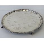 A HM silver salver marked HMS Dragoon 1933 bearing twenty-one engraved signatures upon and