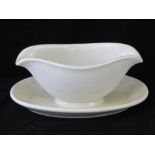 A WWII German Luftwaffe Officers Mess sauce boat having integral drip tray, marked Rossenthal.