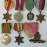 A WWII British five medal group; War, Defence, 1939-45 Star, Africa Star, and Italy Star,