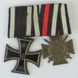 A WWI German 1914-18 medal marked W.R., and a 2nd Class Iron Cross, with ribbons/bar.