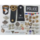 A quantity of assorted military and civil buttons, badges, etc.