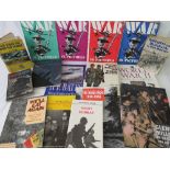 Fifteen military themed reference and fiction books.