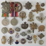 Twenty-eight military badges and medals including 1929-45 War and Defence medals,