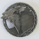 A WWII Kreigsmarine Blockade Breakers badge marked 'FEC Otto Placzek Berlin Auf.