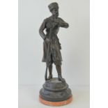 A 19thC bronze sculpture of a Cossack soldier after Evgeny Aleksandrovich Lansere,