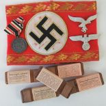 A quantity of WWII German items including Luftwaffe cap eagle, 1939-40 medal,