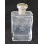 A large German dressing table bottle having white metal top,