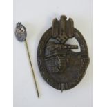A WWII Panzer stick pin and badge, badge marked IA. Two items.