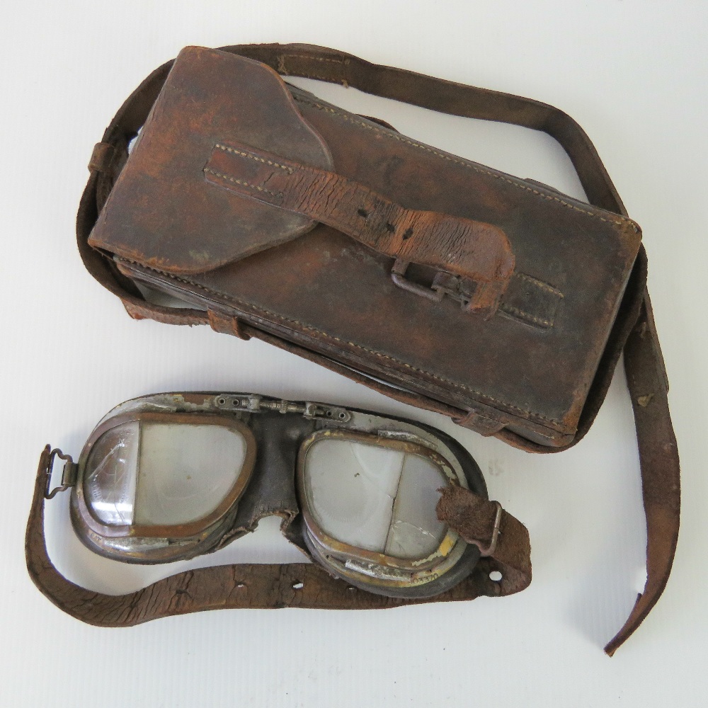 A pair of vintage flying goggles stamped REGD 903370, strap a/f,