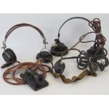 Thee sets of WWII headphones and a Morse code key.