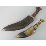 Two kukri daggers complete with scabbards,