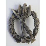 A WWII German Infantry Assault badge marked 'R.S.S'.