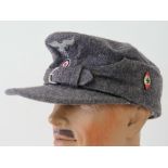 A reproduction WWII German HItler Youth ski cap having cloth eagle.