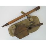 A WWII British military issue entrenching tool (pickaxe/shovel) dated 1944 in canvas pouch dated