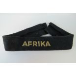A WWII German Afrika cuff title removed from a uniform - used condition.