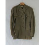 A WWII British Artillery Major's great coat, dated 1944, together with tunic and trousers,