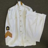 A Royal Marines No3 Dress tunic having two patches to sleeve and metal RM epaulette badges (Chest