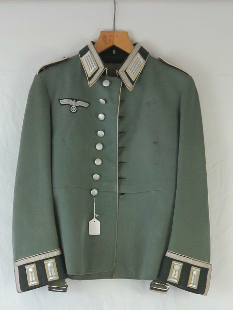 A German WWII Infantry NCO Parade tunic complete with button epaulettes, collar patches and badges.