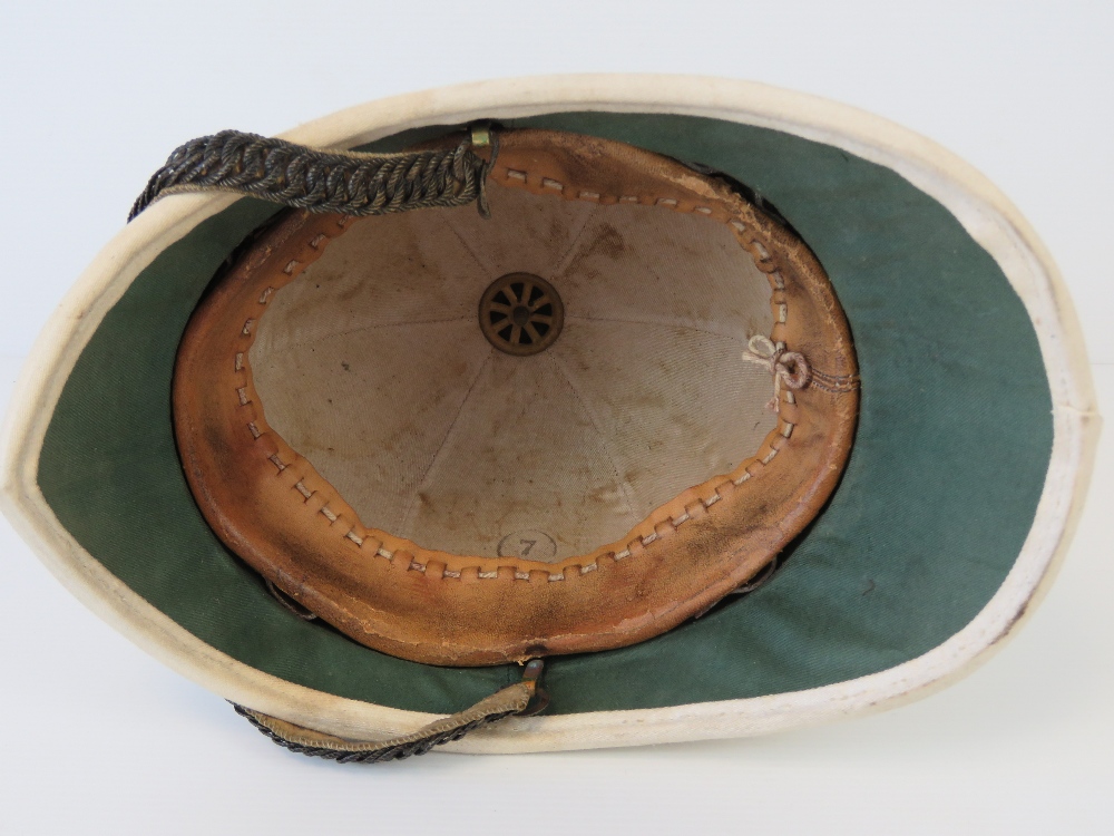 An original canvas covered tropical German pith helmet having leather lining and articulated chin - Image 2 of 2