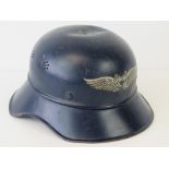 A WWII German Luftschutz helmet having single decal to front, label within,