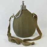 A WWII Italian military issue water bottle with felt cover, stopper and strap.