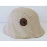 A WWI Austrian helmet having original liner, replacement canvas cover.