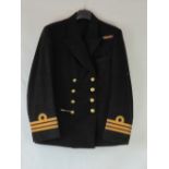 A British WWII Naval Officers tunic complete with brass buttons and three stripes to each cuff.