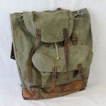 A mid 20thC Swiss Army canvas and leather rucksack.