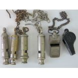 Six vintage whistles; an Acme Thunderer 'made in England', a plastic Acme, 'The Metropolitan' by J.
